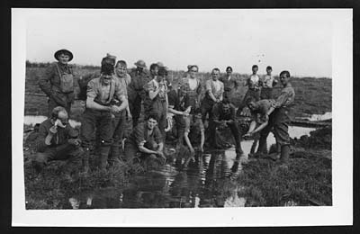 Tommy's first job after a battle - guardsmen having a wash & brush up ...