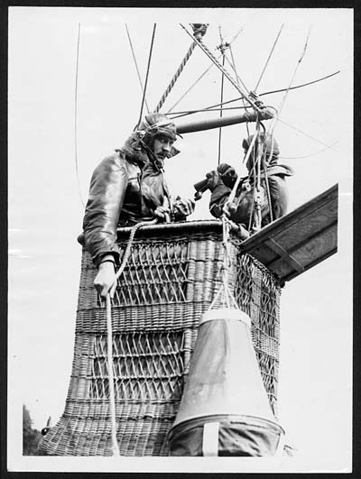Observers in the basket with telephones and maps