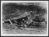 Thumbnail of file (165) C.1547 - Some men in a shell hole 5 kilometres beyond the old German front line