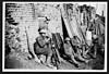 Thumbnail of file (265) D.2159 - Men of the Dorsets cleaning their rifles in a ruined farm