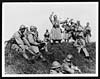 Thumbnail of file (13) C.2502 - French soldier entertains his comrades during the rest by the road-side