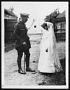 Thumbnail of file (255) C.1889 - British officer conversing with a little French girl who is just going to her first mass