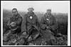 Thumbnail of file (430) D.544 - Three youthful German prisoners of 17 years resting on their way to the cage