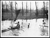 Thumbnail of file (128) D.1355 - Tommies swimming and sailing a home-made boat whilst at rest