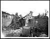 Thumbnail of file (41) D.1102 - Tommies attacking the wall of a house blown up by the Germans in their retreat and left in an unsafe condition