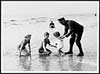 Thumbnail of file (40) N.445 - British Tommy interests himself in the happiness of the kiddies on the sands at a French coast resort