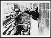 Thumbnail of file (42) N.449 - Old Frenchwoman in Amiens evacuating her house leaving her pet canary to the tender mercies of a British Tommy