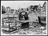 Thumbnail of file (84) N.587 - Two British Tommies have an impromptu game of nap among the ruins of a shattered town
