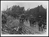 Thumbnail of file (122) X.33097 - Cyclists moving forward through a recently captured village