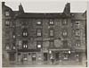 Thumbnail of file (14) View of a street of three storey tenement buildings with shops on the ground floor