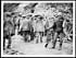Thumbnail for 'D.654 - Working party about to start off in the rain wearing waterproof sheets and trench waders'