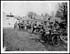 Thumbnail for 'X.34090 - Cyclists resting in a captured village'