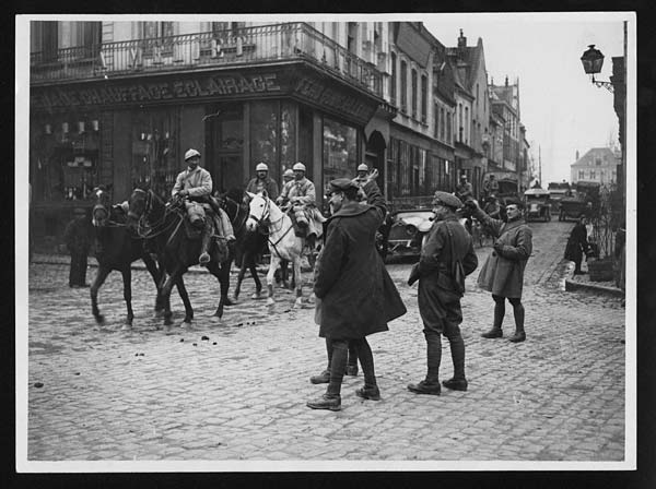 (3) B.84 - Tommy salutes French troops passing through a town