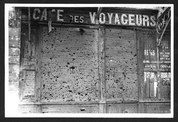 (172) C.1568 - Shutter of a shop in the Station Sq., Arras, shrapnel has done this