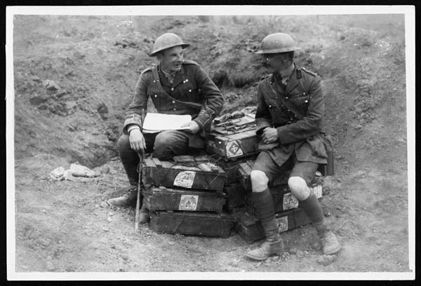 (198) D.1692 - Staff officer discussing matters on a pile of bombs