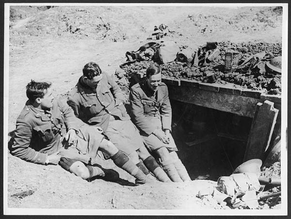 (102) D.1283 - Three officers of the Gordons chatting at entrance of a dug-out