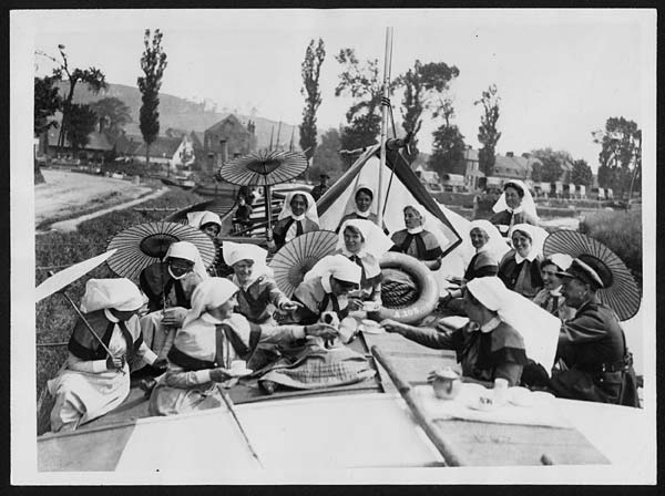 (102) L.656 - Red Cross Barge Nurses during a quiet spell in France take tea in a barge