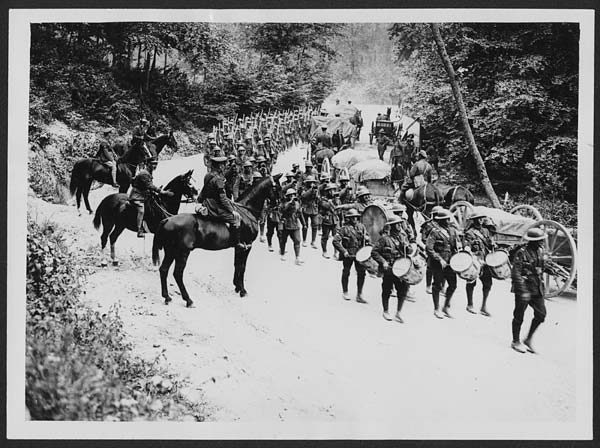 (110) L.666 - Manchester Regiment on a road in France, marching past on their way to the line