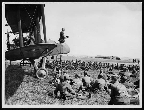 (7) L.1127 - Army chaplain conducts a service from the cockpit of an aeroplane, France, during World War I