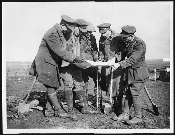 (107) X.33037 - Some officers studying a map of newly captured ground