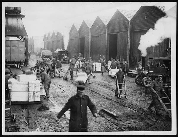 (112) X.33054 - Scene on the quay showing some store houses