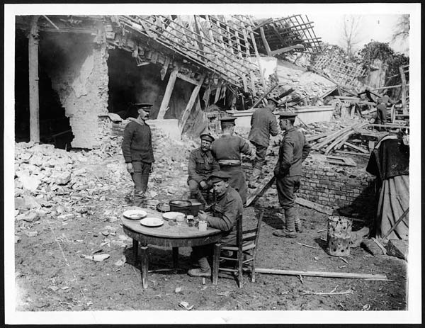 (134) X.34046 - Some Tommies having dinner in a captured village