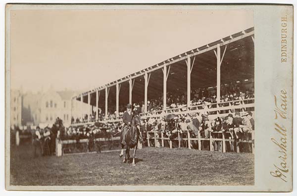 Photograph of a horse jumping event