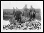 C.1487Spanish Officers inspecting a heap of captured German hand grenades, machine gun ammunition, etc.