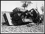 D.2933One result of the heavy rains - a light railway engine on its side owing to the rails sinking