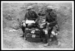 D.1692Staff officer discussing matters on a pile of bombs