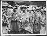 D.577Group of French 'Tommies' come straight out of the trenches to receive English decorations