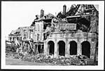 D.1017Wrecked building on the Grande Place, Peronne, showing German notice