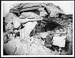 D.2090Officer studying a map outside a German pill box destroyed by our artillery