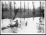 D.1355Tommies swimming and sailing a home-made boat whilst at rest