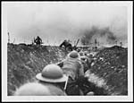 D.1154Officer leads the way amidst the bursting of German shells