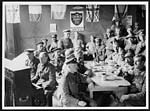 L.561French and British troops in France having a sing song at a Church Army depot