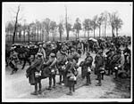 N.383French troops on the road moving up with British Tommies on the roadside near the Line