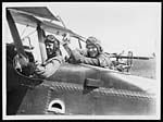 N.397Cheery pilot and observer with their mascot pup ready for a flight over the German lines