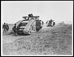 X.25012Tanks passing dead Germans who were alive before the cavalry advanced a few minutes before the picture was taken