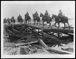 X.33042Cavalry passing over a temporary bridge built by our troops to replace the bridge destroyed by the Germans