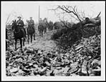 X.34079Cavalry passing through a wrecked village