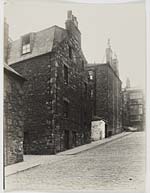 Side of three storey Tenements up a hill